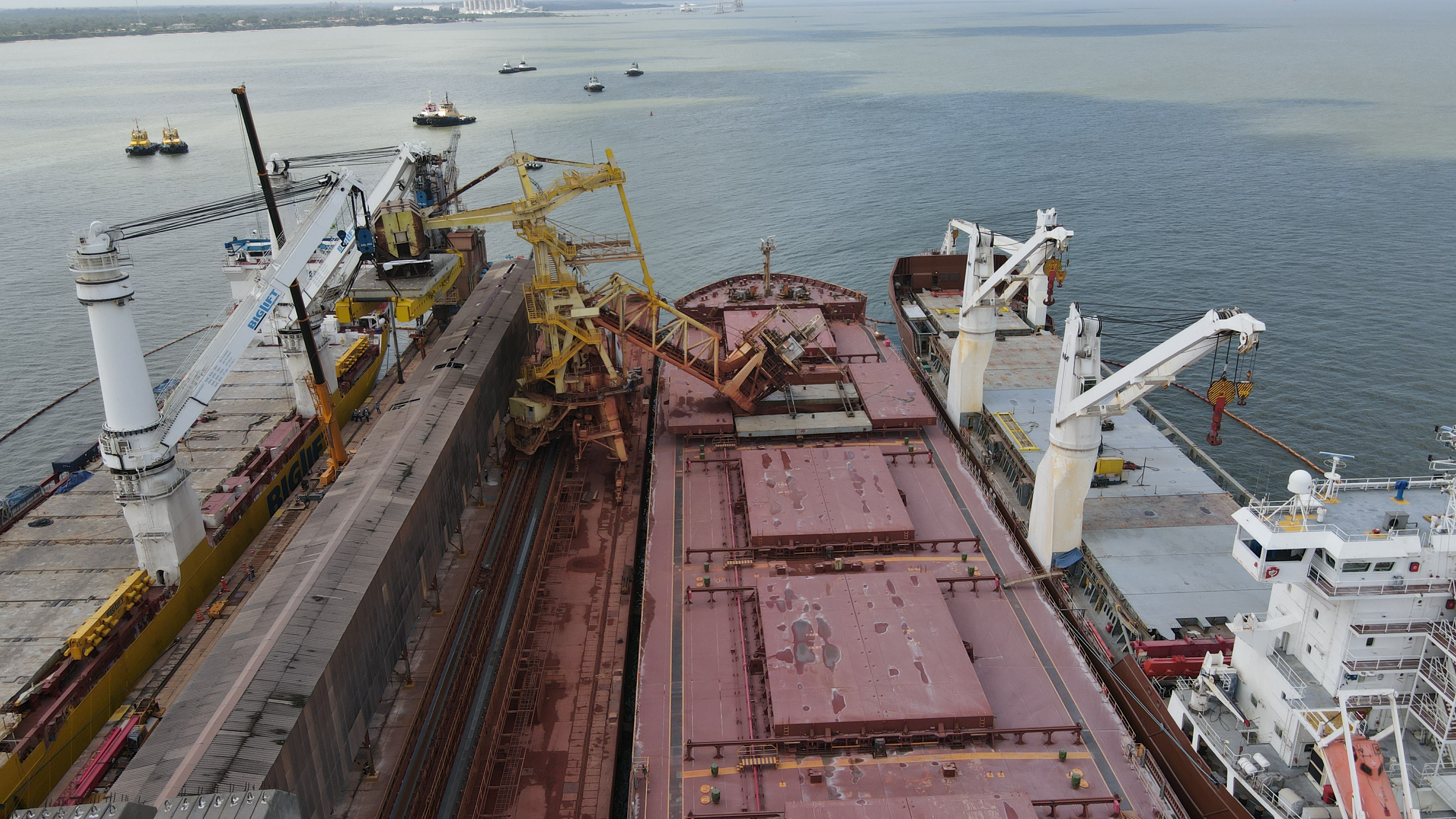 The Tuncare docked between two ships
